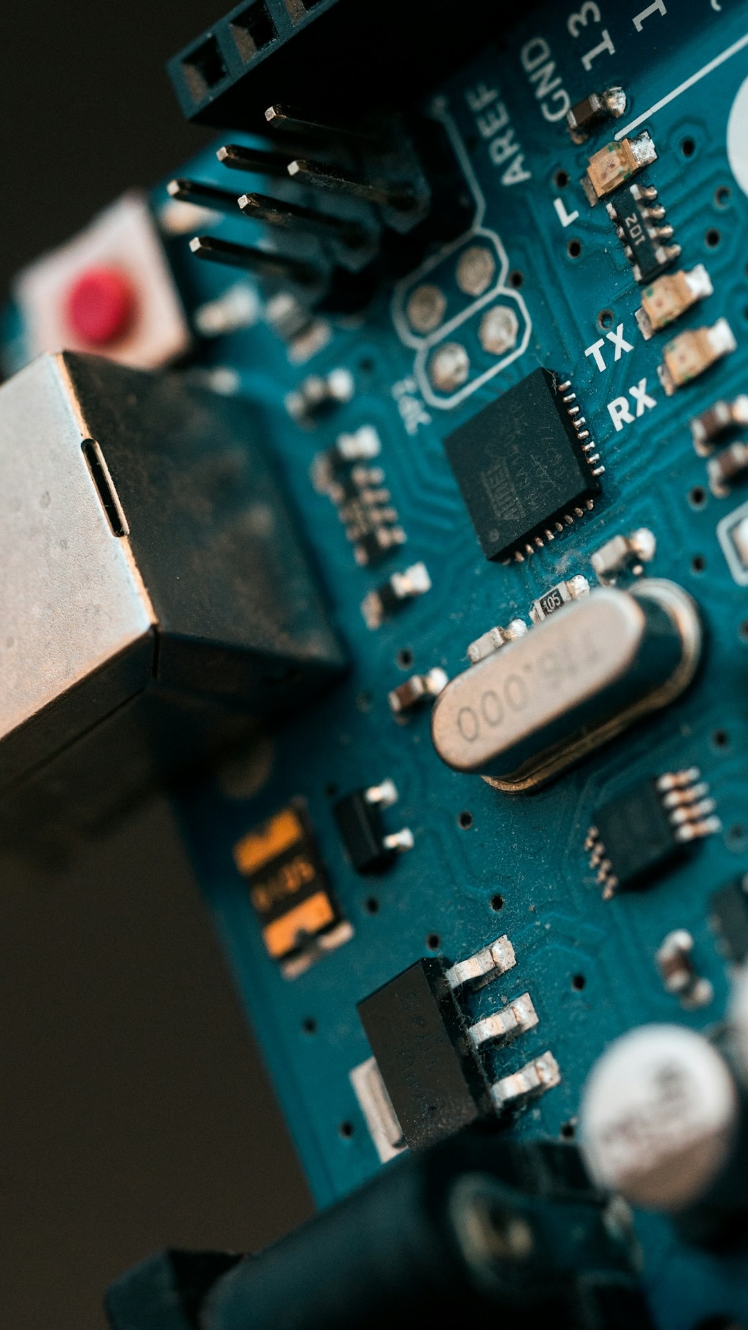 Close-up of a blue circuit board with electronic components